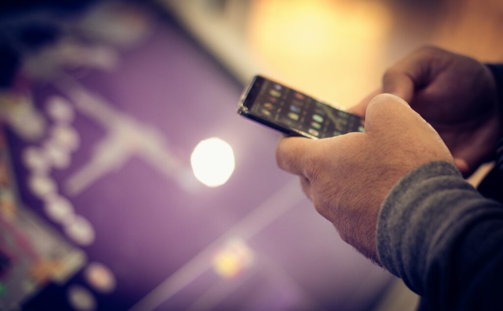 Man on phone gambling